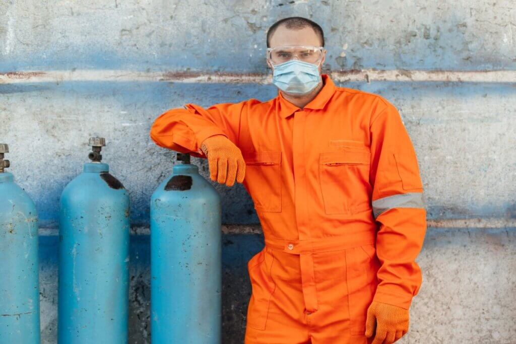 Worker in protective suit and mask.