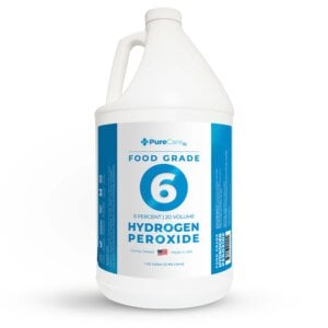 A white one-gallon jug of 6% food grade hydrogen peroxide on a white background.