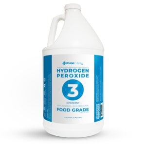 A white one-gallon jug of 3% food grade hydrogen peroxide on a white background.